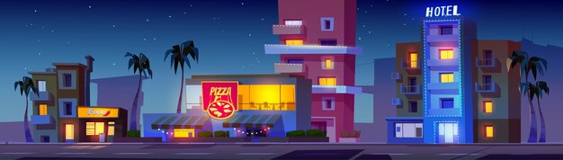 Edificios nocturnos en la calle Miami con luz de neón
