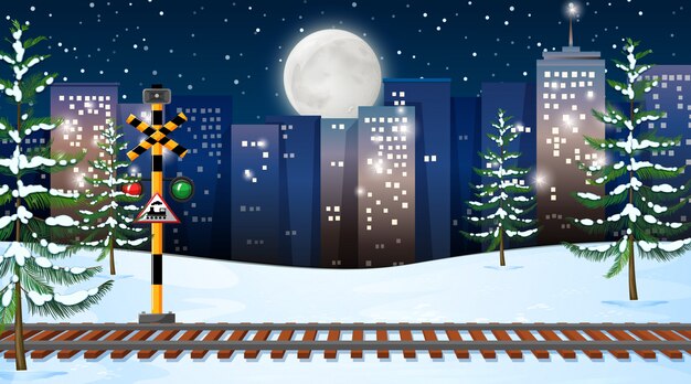 Escena de nieve con vías de tren en la noche