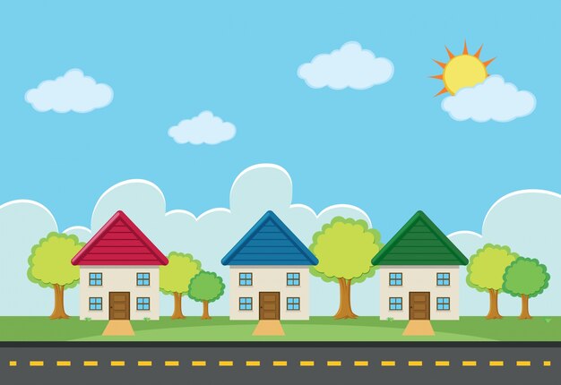Escena con tres casas a lo largo de la carretera