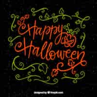 Vector gratuito escritura de feliz halloween con decoración floral