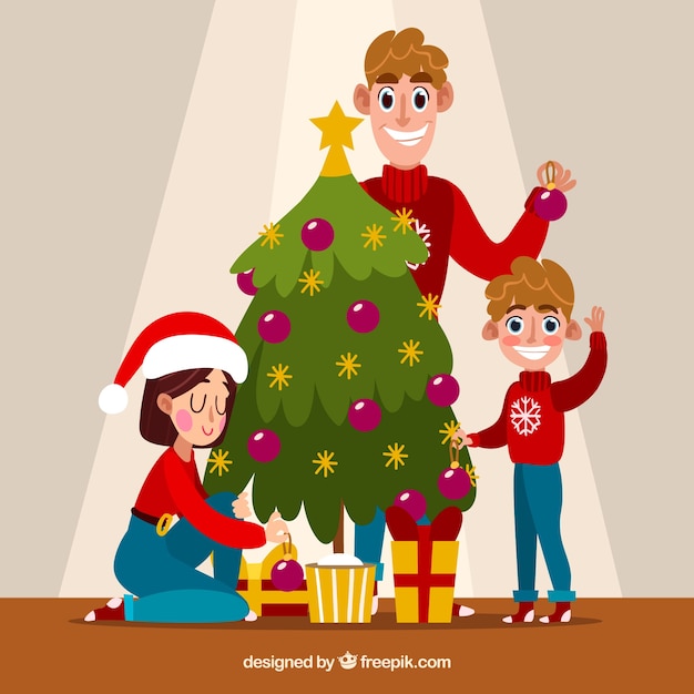 Familia decorando un árbol de navidad