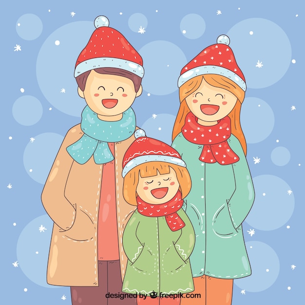 Familia feliz en un día nevado
