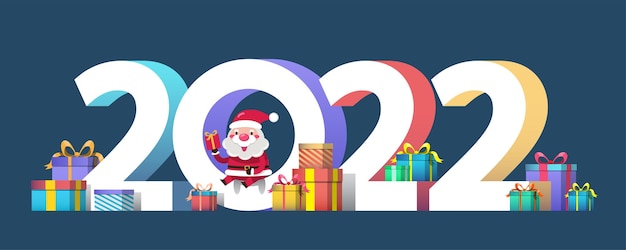 Feliz año nuevo 2022 con santa claus presenta una caja de regalo para personas en el mundo. elemento de recorte de feliz navidad para tarjetas navideñas, invitaciones, pancartas, carteles y decoración de celebración de sitios web