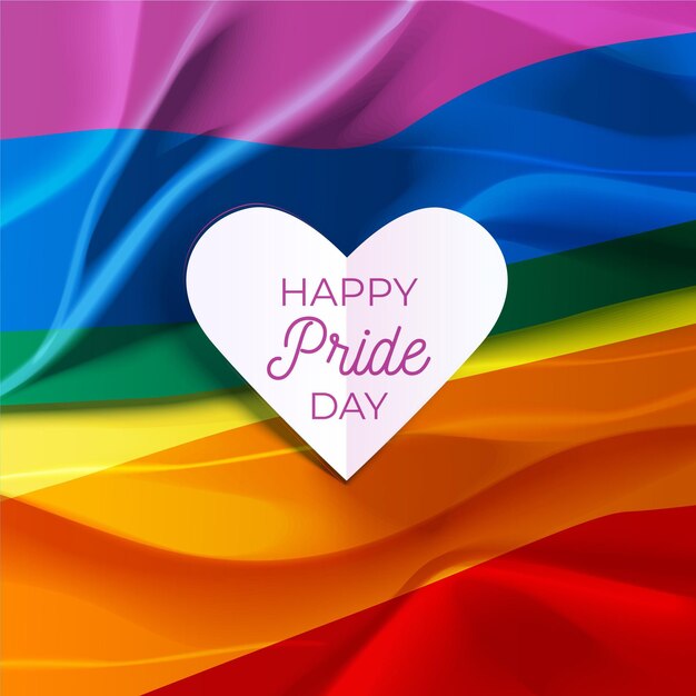 Feliz día del orgullo letras en una bandera del corazón y el arco iris