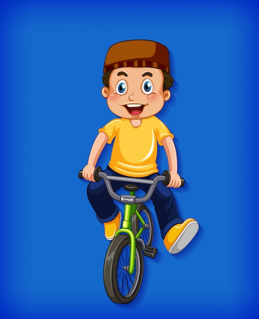 Feliz niño musulmán montando bicicleta