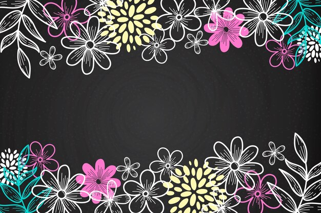 Flores dibujadas a mano sobre fondo de pizarra