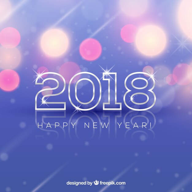 Fondo del año nuevo 2018 con efecto bokeh