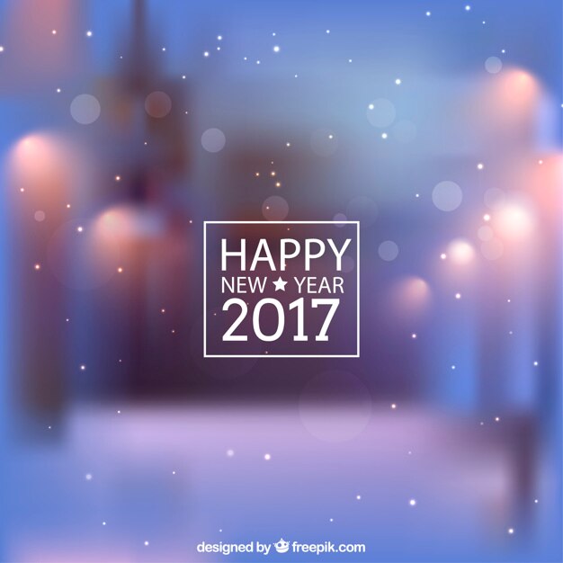 Fondo de año nuevo azul desenfocado con copos de nieve 