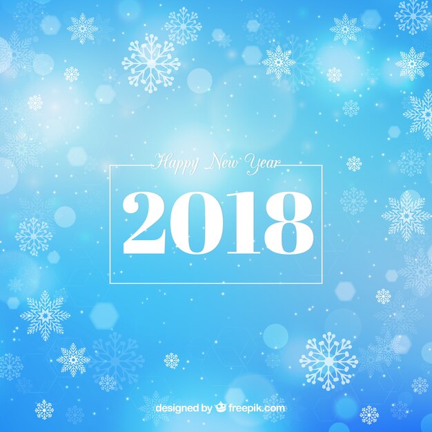Fondo azul de año nuevo con efecto bokeh