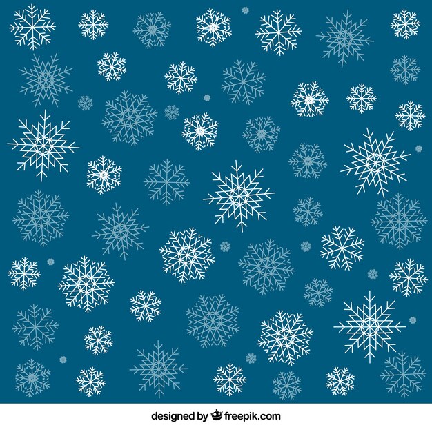 Fondo azul con copos de nieve blanca