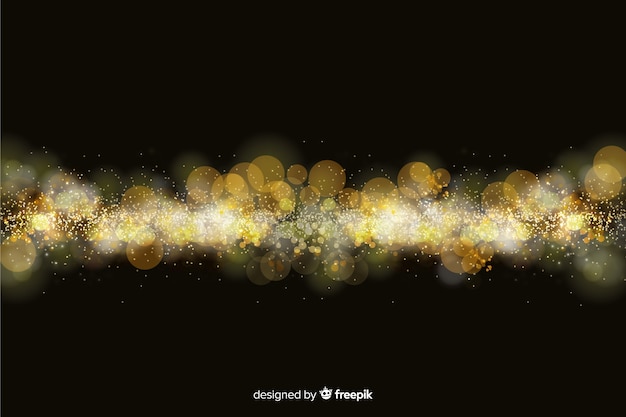 Fondo bokeh con partículas doradas