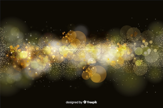 Fondo bokeh con partículas doradas