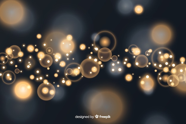 Vector gratuito fondo bokeh con partículas doradas