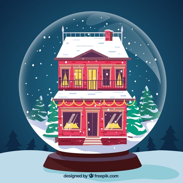 Fondo de bola de navidad con bonita casa roja nevada 
