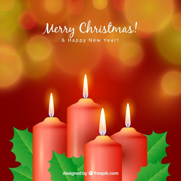 Fondo borroso de navidad con cuatro velas rojas