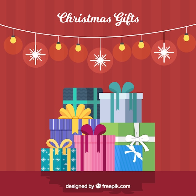 Vector gratuito fondo con cajas de regalo de navidad en diseño plano