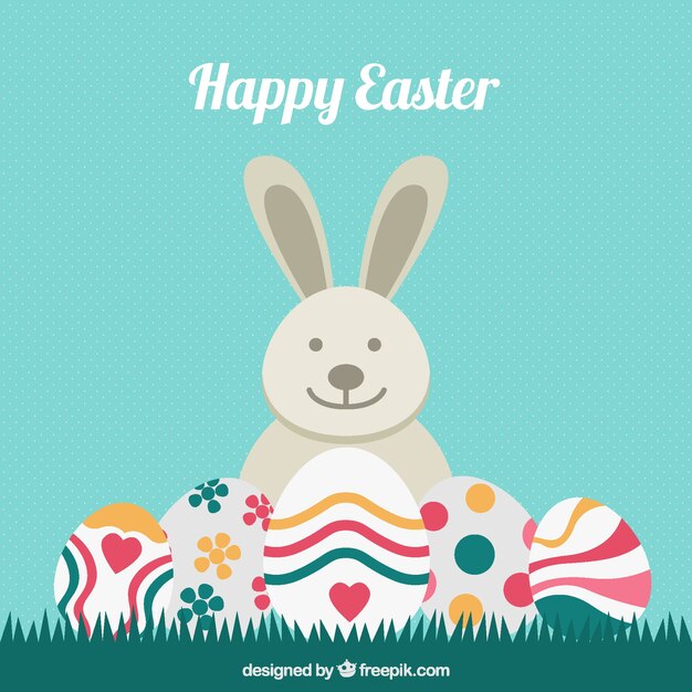 Fondo de conejo con huevos de pascua decorativos 