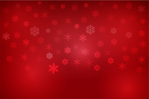 Fondo de copos de nieve de navidad rojo degradado