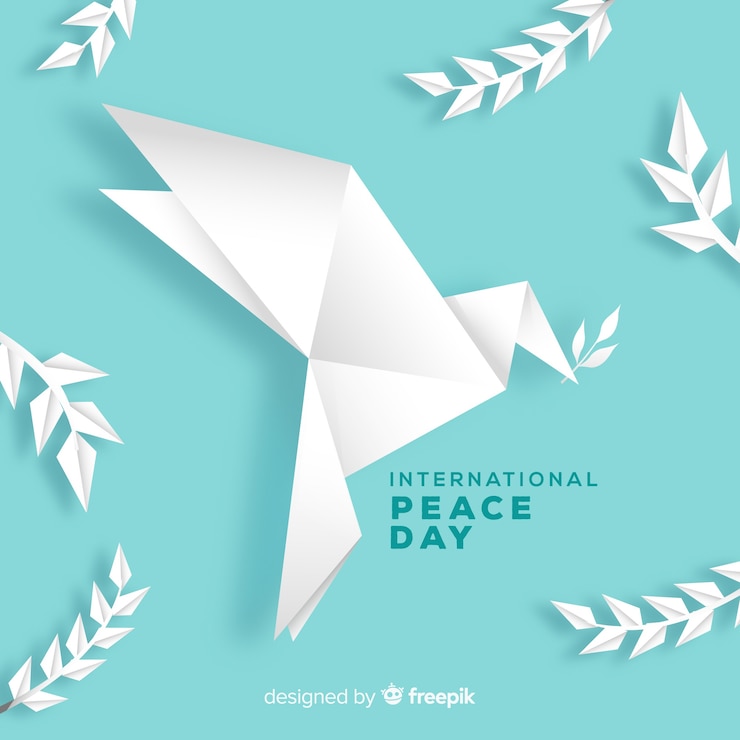 Vector gratuito fondo del día de la paz con paloma en origami