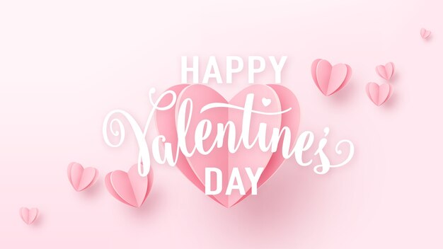 Fondo del día de San Valentín con corazones de papel rosa claro y letrero de texto blanco.