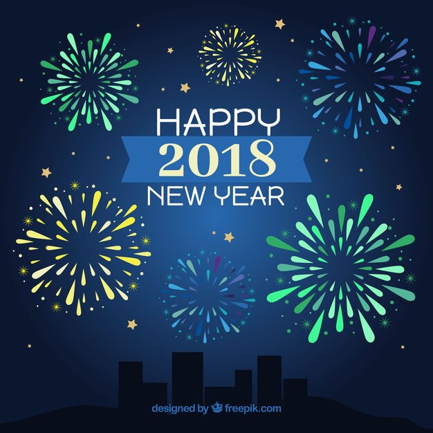 Fondo de feliz año nuevo con fuegos artificiales verdes, amarillos y azules