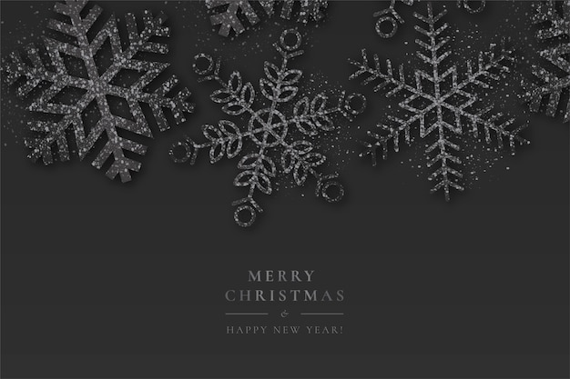 Fondo negro de Navidad con copos de nieve brillantes