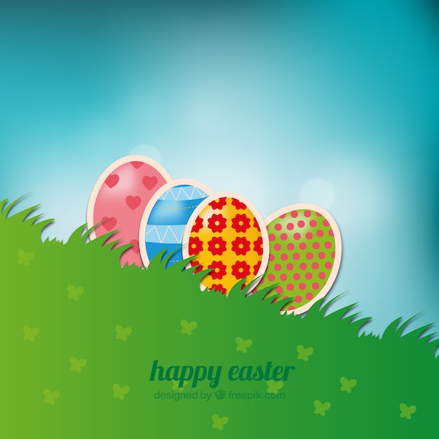 Vector gratuito fondo de pascua con los huevos en la hierba