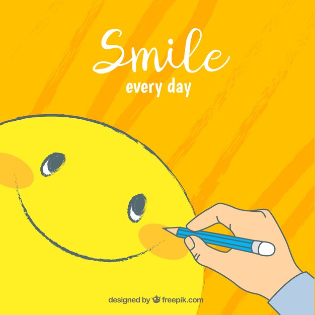 Fondo positivo con persona dibujando una carita sonriente