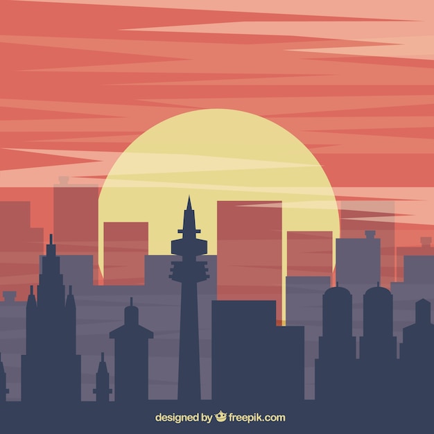 Vector gratuito fondo con siluetas de edificios al atardecer