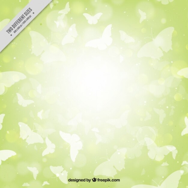 Vector gratuito fondo verde brillante de siluetas blancas de mariposas