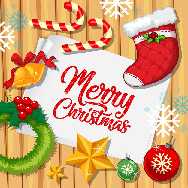 Fuente Feliz Navidad en papel con objetos navideños vista desde arriba