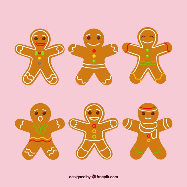 Galletas de hombre de jengibre sobre un fondo rosa
