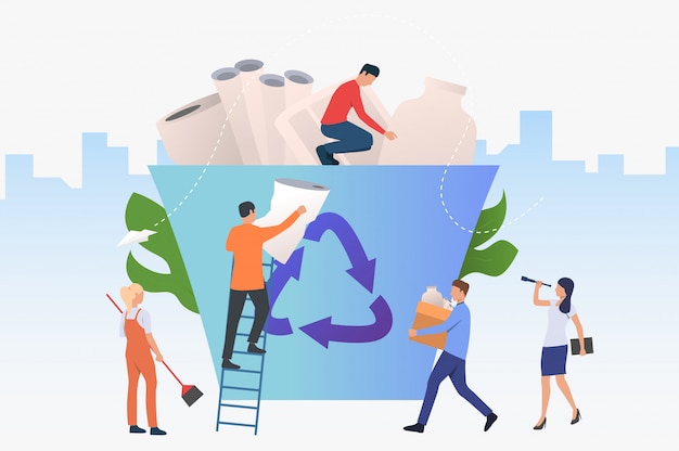 Gente poniendo basura en un gran contenedor de reciclaje