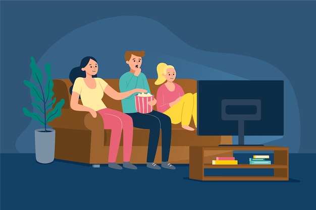 Gente viendo una película en casa