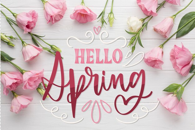 Hola letras de primavera con hermosas rosas rosadas