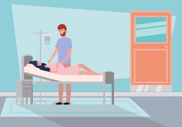 Hombre con embarazo mujer en cuarto de hospital
