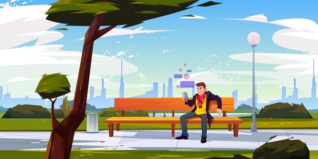 Hombre con smartphone sentado en un banco en el parque de la ciudad