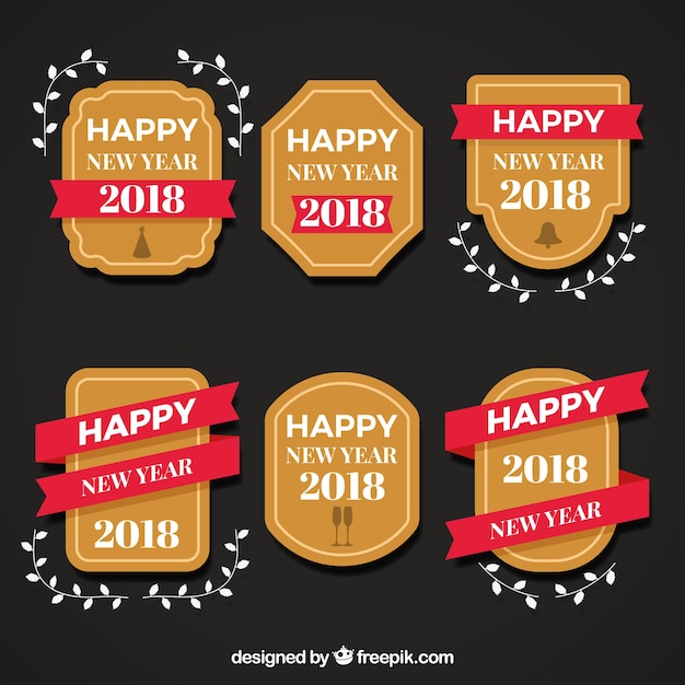 Insignias simples de año nuevo con cintas rojas