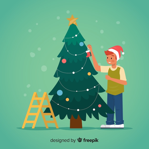 Joven decorando el árbol de navidad