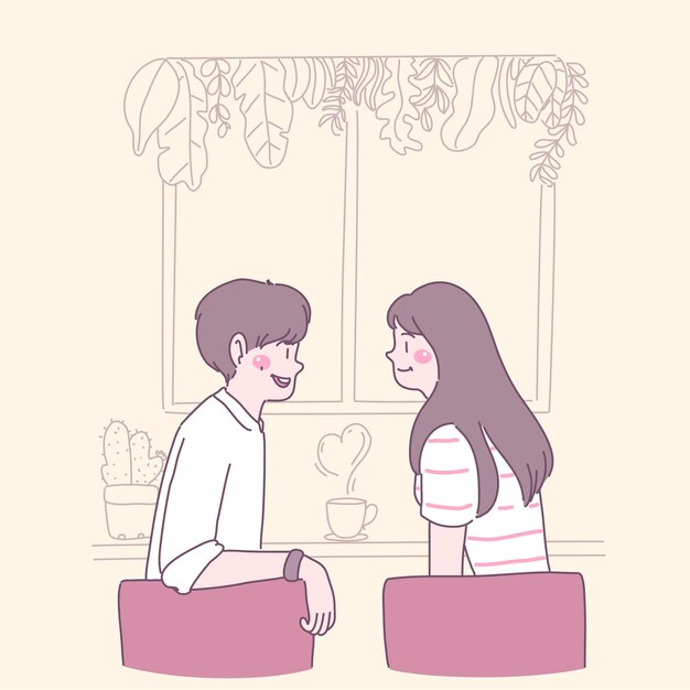 Los jóvenes enamorados se sientan en sillas y toman café junto a la ventana.