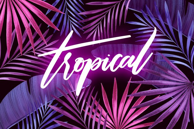 Letras tropicales con hojas o flores.