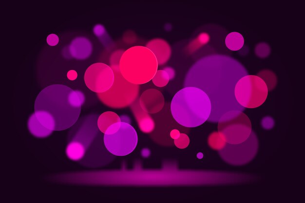 Luces bokeh rosa sobre fondo oscuro
