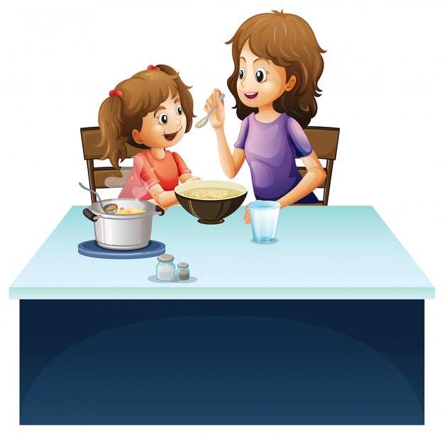 Madre que alimenta al niño en la mesa