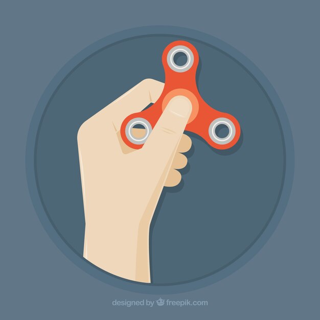 Mano sujetando un spinner rojo