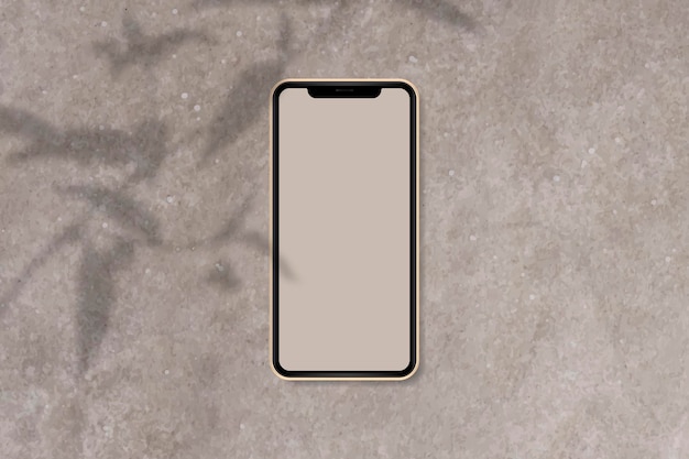 Maqueta de teléfono sobre fondo de mármol marrón