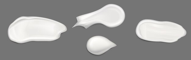 Muestra y gotas de crema o loción blanca