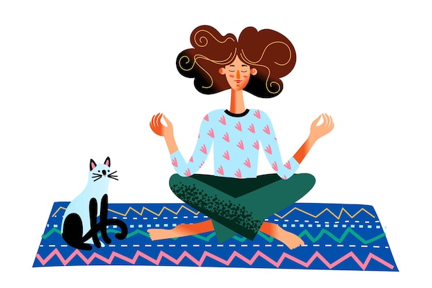 Mujer meditando en posición de loto sentada en la alfombra cerca de un lindo gato niña practica yoga y prácticas de atención plena en casa estilo de vida feliz yogui saludable