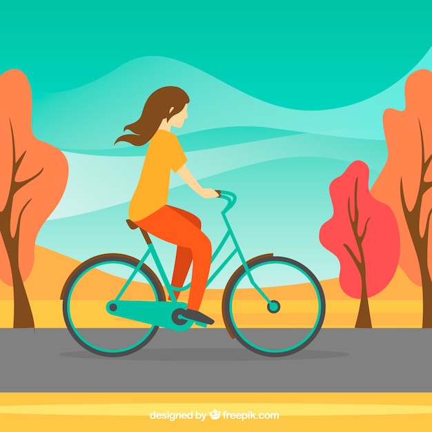 Vector gratuito mujer montando en bici y paisaje otoñal