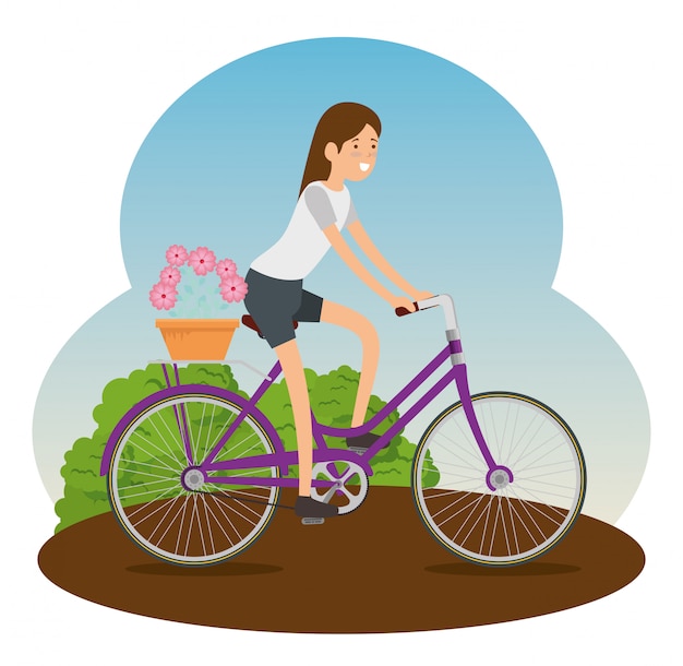 Mujer montando una bicicleta para hacer ejercicio