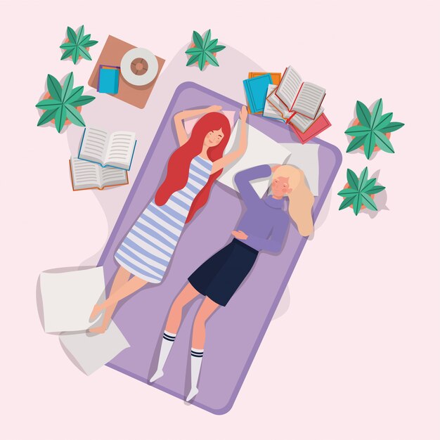 Mujeres jóvenes relajándose en un colchón en el dormitorio